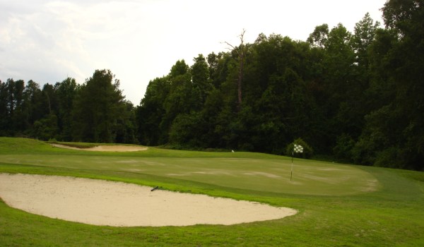 view of golf course with sand trap